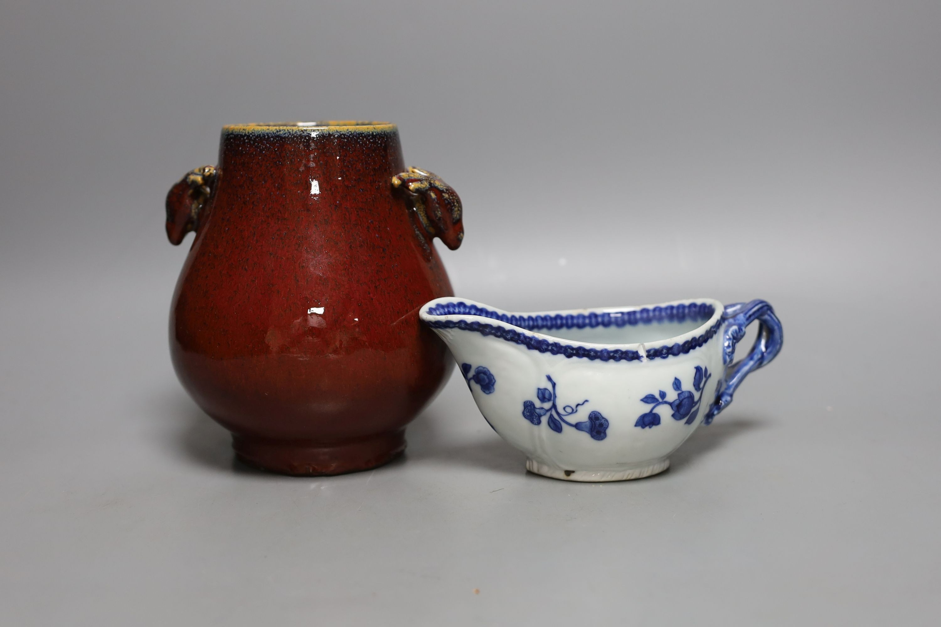 An 18th century Chinese export tea cup, 3 pieces of export blue and white and a sang de boeuf vase. Tallest 16cm